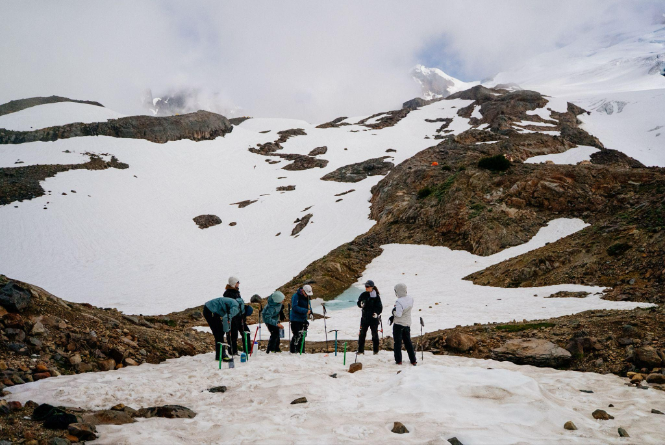 Climbers practicing mountaineering skills on snow below the Easton Glacier